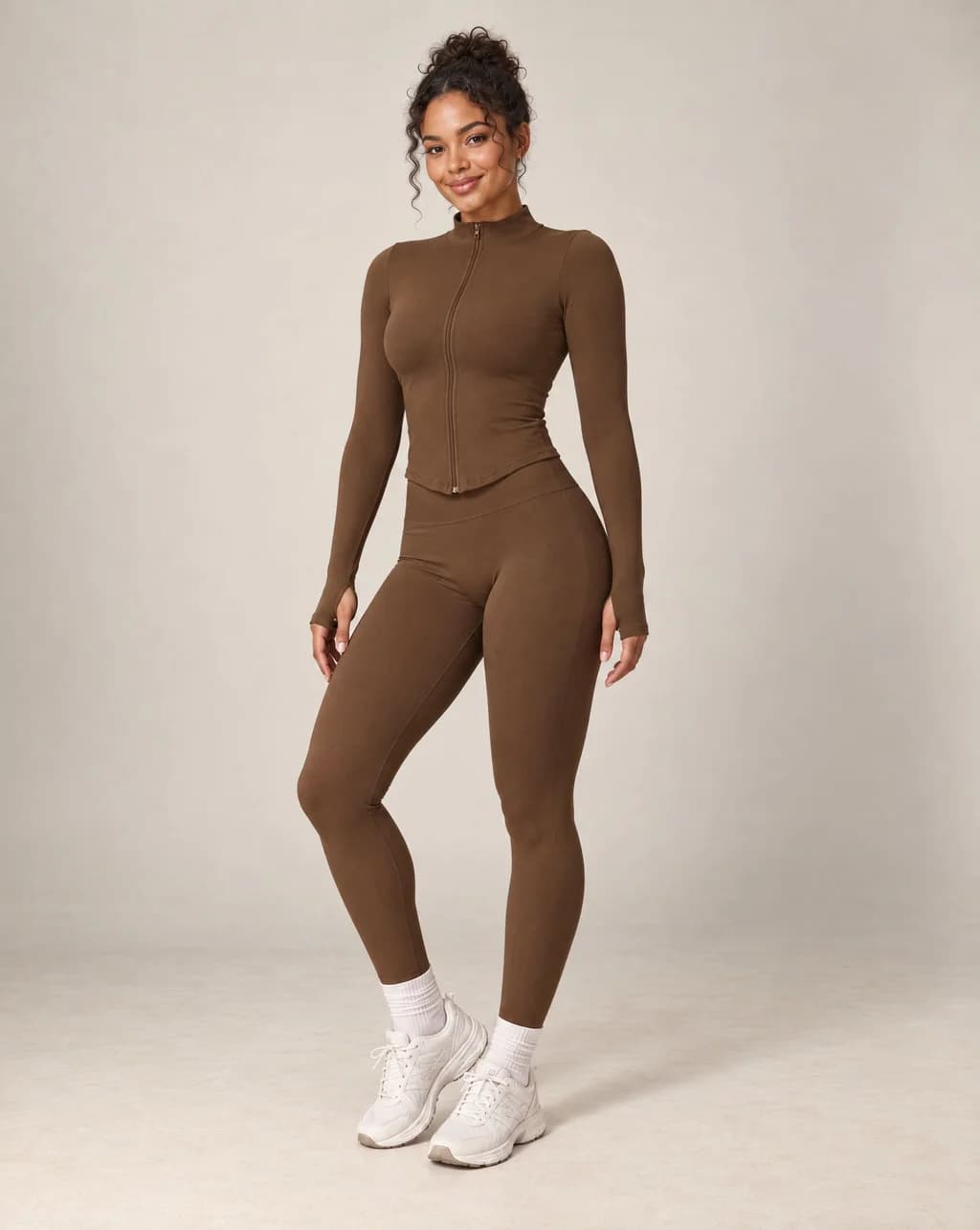 Brown stand-collar zip-up yoga jacket with long sleeves and front zipper
