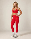 Red high-waist fitted workout leggings with ankle-length leg cuffs