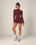 Zip-up yoga jacket and fitted shorts set, deep red with long sleeves and zip front