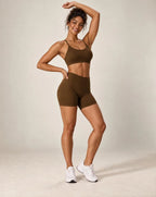 Brown cross-back sports bra and matching workout shorts set