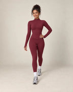 Burgundy zip-up workout jacket and matching leggings set with long sleeves and slim fit