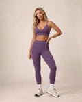 Purple sports bra and high-waist leggings set with ankle length and white socks