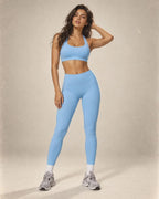 Sky blue sports bra and high-waist leggings set with matching crew back design.