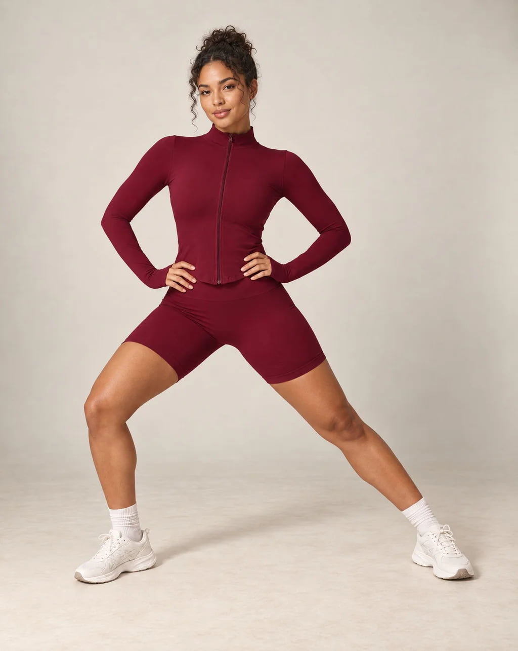 Burgundy stand-collar zip-up yoga jacket with long sleeves and front zipper