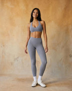 Light blue halter sports bra and high-waist leggings set, fitted stretch full length