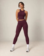 High-waist seamless yoga leggings in plum wine red with ankle-length legs and snug fit
