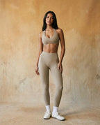 Light khaki halter sports bra and high-waist leggings set, fitted stretch full length
