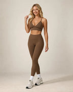 Brown high-waist fitted workout leggings with ankle-length leg cuffs
