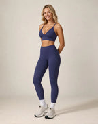 Navy blue high-waist fitted workout leggings with ankle-length leg cuffs