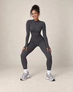 Dark gray zip-up workout jacket and matching leggings set, long sleeves and slim fit
