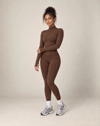 Brown zip-up workout jacket and matching leggings set with long sleeves and slim fit