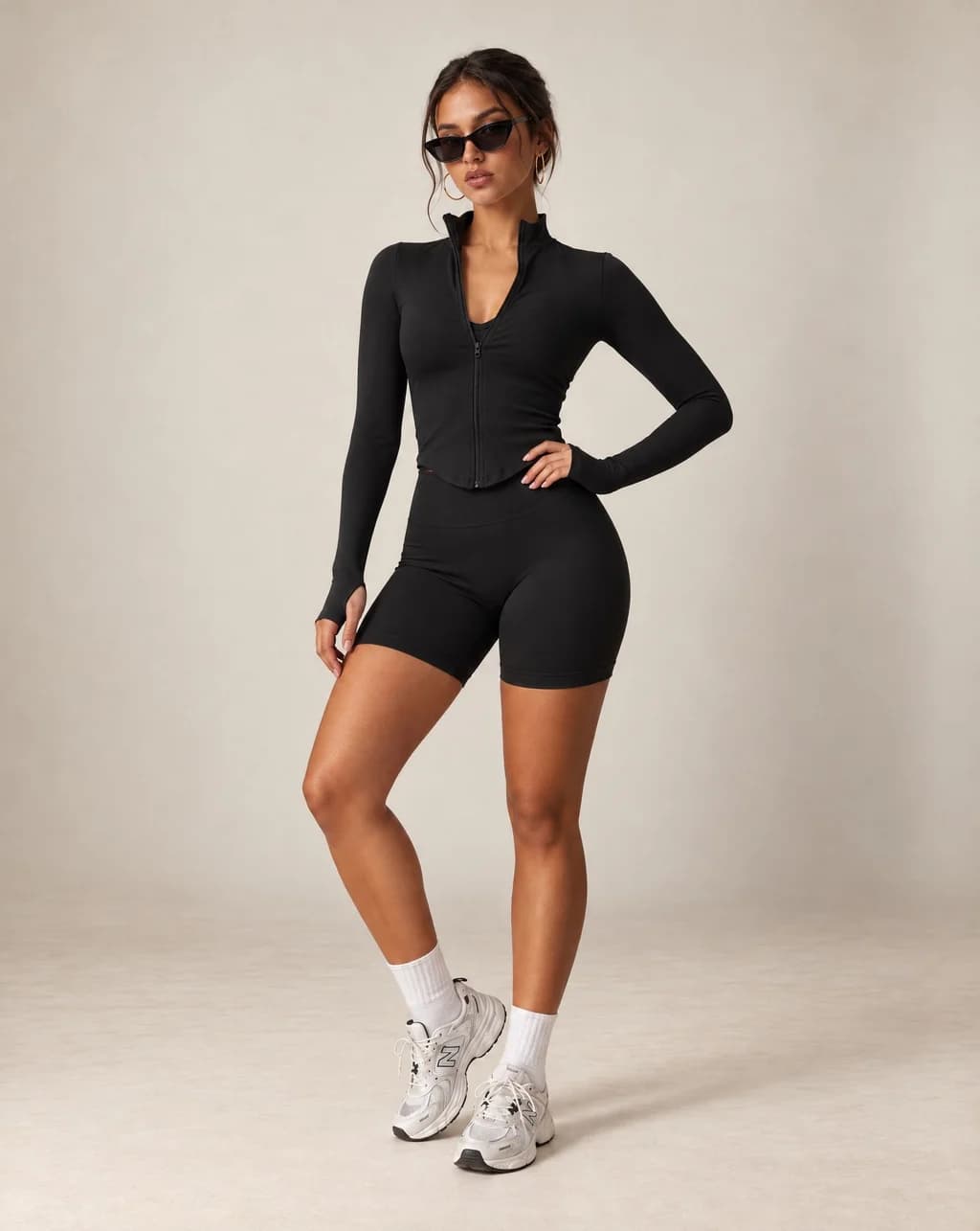 Black fitted zip-up yoga jacket with stand collar, long sleeves