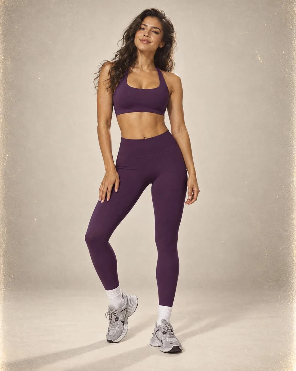 Purple sports bra and high-waist leggings set with fitted, smooth finish.