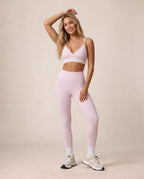 Light pink sports bra and high-waist leggings set with ankle length and white socks