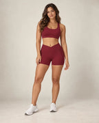 High-waisted fitted yoga shorts in burgundy with front seam pocket