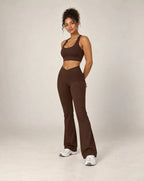 High-waisted flared active pants in brown, soft feel.