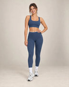 Navy colorblock high-waisted yoga pants with white side panels and ankle-length legs