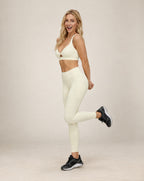 White cutout workout sports bra with deep V front and racer back
