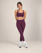 Deep plum high-waisted yoga pants with white waistband and ankle-length legs
