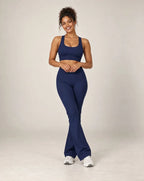 High-waisted flared active pants in midnight blue, soft feel.