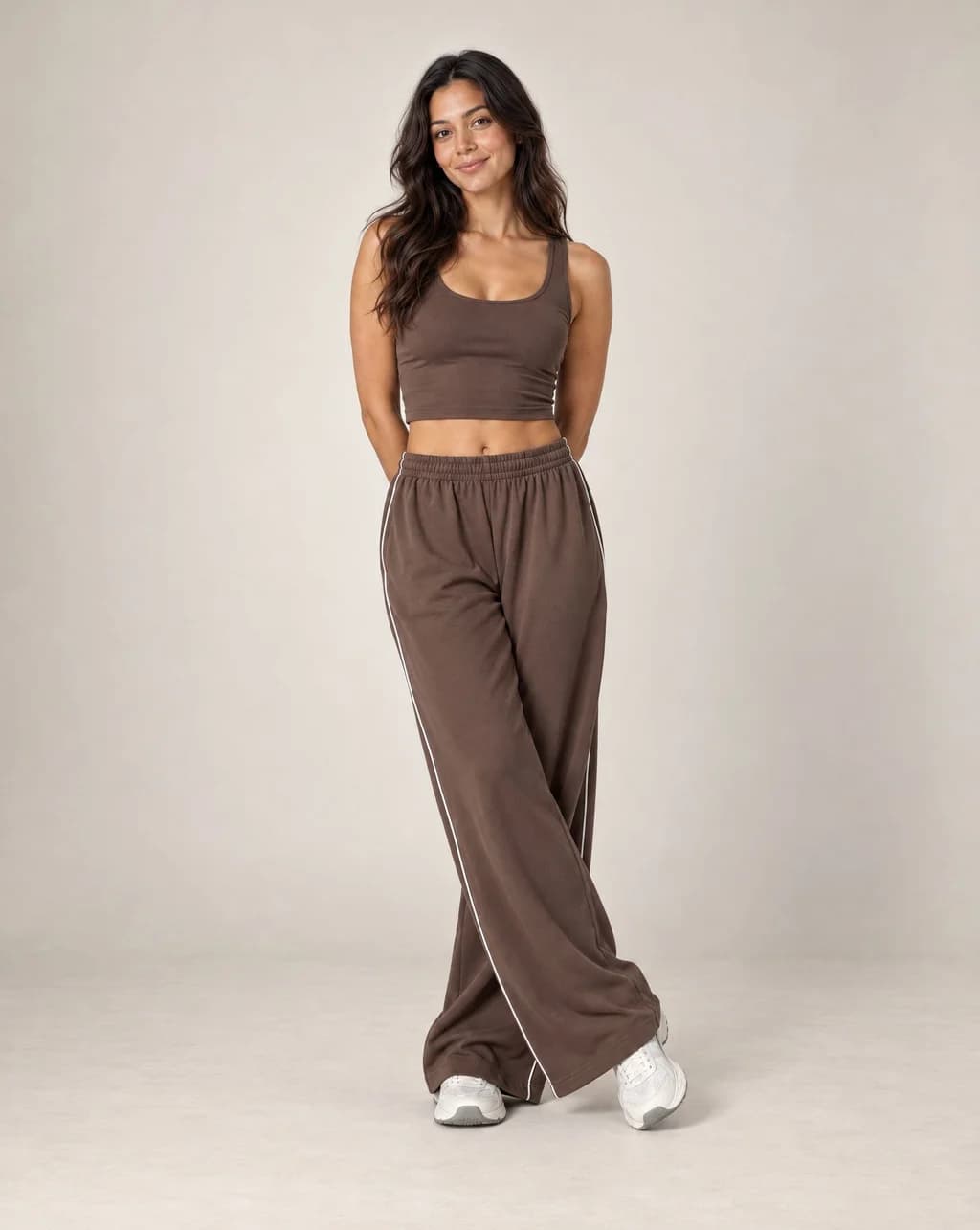 Dark brown high-waisted relaxed straight-leg sweatpants with elastic waistband and side stripe
