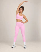 Pink colorblock high-waisted yoga pants with white waistband and ankle-length legs