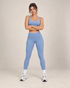 Blue colorblock high-waisted yoga pants with white side panels and ankle-length legs