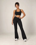 High-waisted flared active pants in black, soft feel.