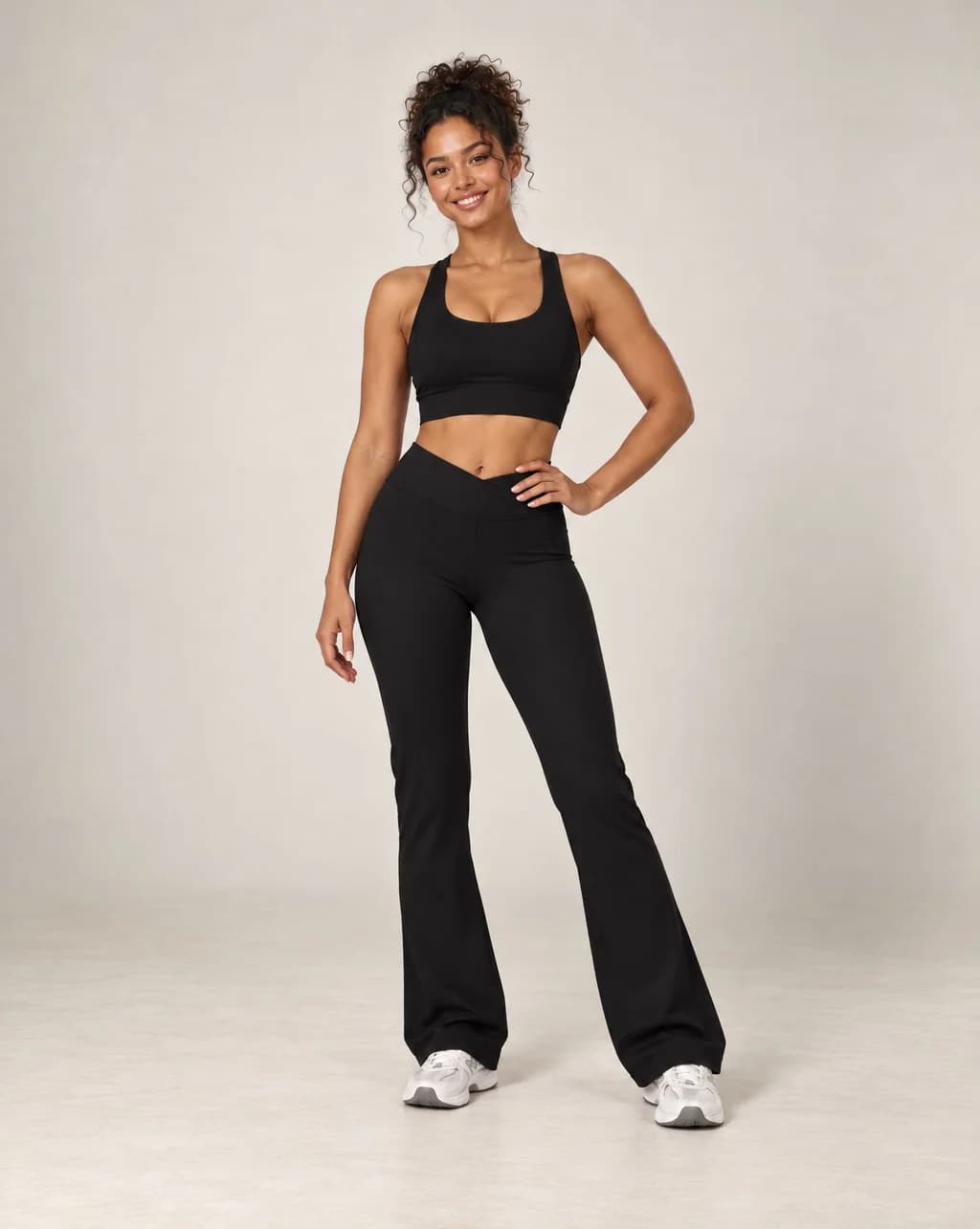 High-waisted flared active pants in black, soft feel.