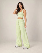 Light green high-waisted relaxed straight-leg sweatpants with elastic waistband and side stripe
