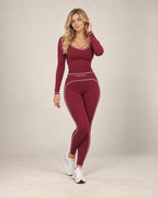 Burgundy long-sleeve slim-fit yoga top with contrast seam detailing and scoop neckline