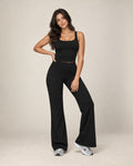 Black high-waisted relaxed wide-leg track pants with flared ankle fit