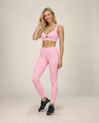 Pink cutout workout sports bra with V neckline and racer back